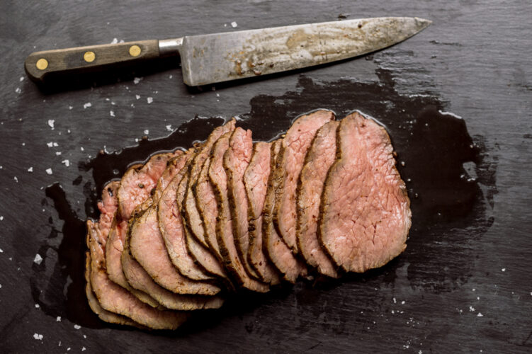 Feed holiday crowds with affordable, marinated roast or salmon